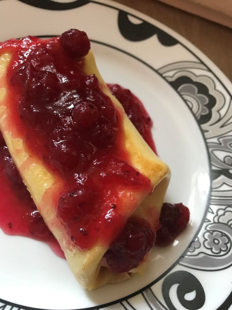 Ricotta filled blintz with lemony cranberry sauce