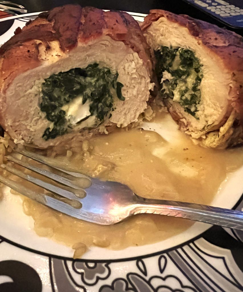 Bacon wrapped chicken breast stuffed with spinach and feta cheese